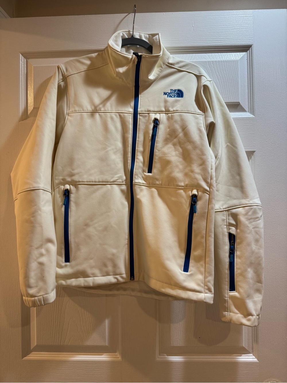 The North Face Men’s Cream Softshell Jacket with Blue Zippers